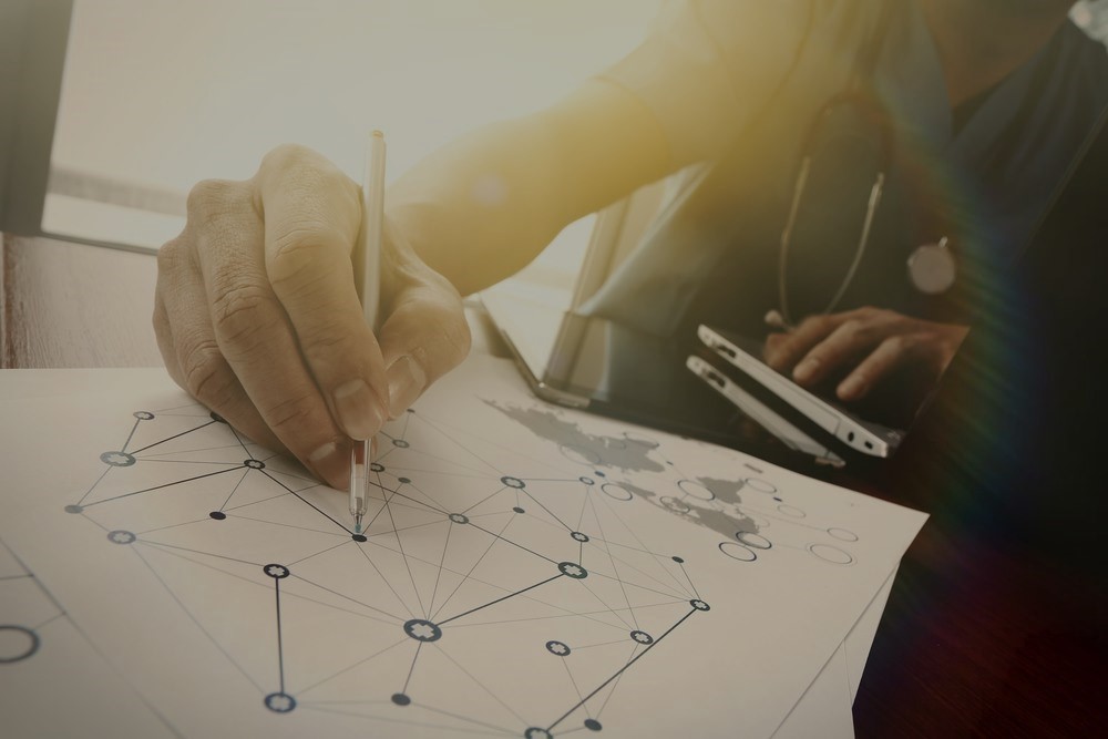 Doctor working with digital tablet and laptop computer in medical workspace office and medical network media diagram as concept